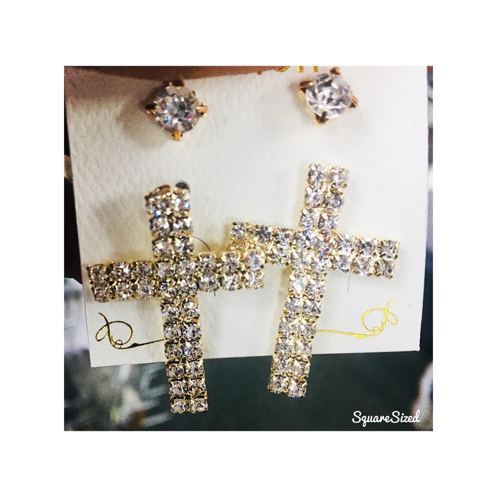 Gold Cross earring.